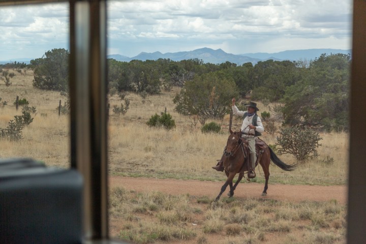 a person riding a horse in a field